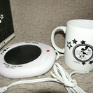 ミッキーマウスのマグカップの保温器とカップ
