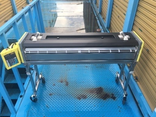 クロス糊付け機