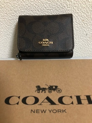 中華のおせち贈り物 コーチ、三つ折り財布、新品未使用、一万円札入り