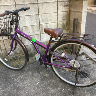 紫色の婦人用自転車（ママチャリ）