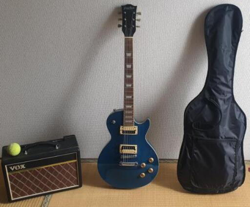 Les Paul風のエレキギターとvoxのアンプ
