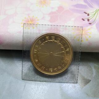 天皇御在位六十年記念１０万円硬貨