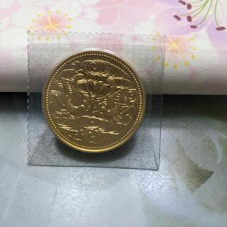 天皇御在位六十年記念１０万円硬貨