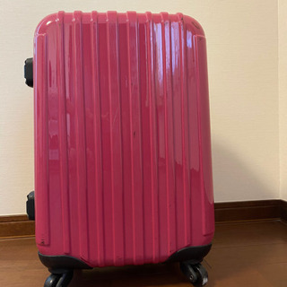 ピンクのスーツケースあげます