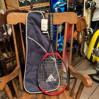 テニスラケットと新品カバー