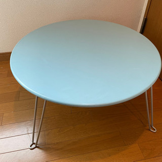 折り畳みパステル水色丸テーブルの画像