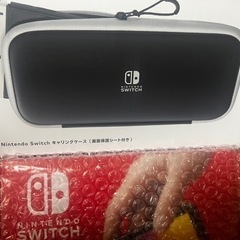 (購入相手決定)任天堂Switch有機EL白 新品未開封 新品未開封の白キャリングケース付き