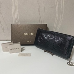 GUCCI グッチ エンボスロゴ GG柄 長財布 ラウンドファス...