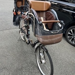 ３人乗る自転車