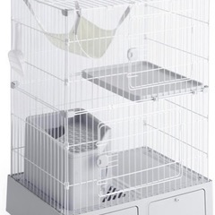 猫用の2段のトイレ付きケージと自動給餌器とペットボトル給水器