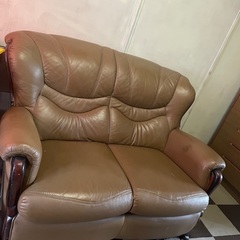 A used two-seater sofa, there ar...