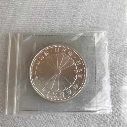 天皇陛下御在位60年記念1万円銀貨