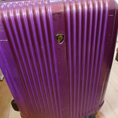 紫のスーツケース