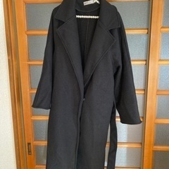 黒のコート　