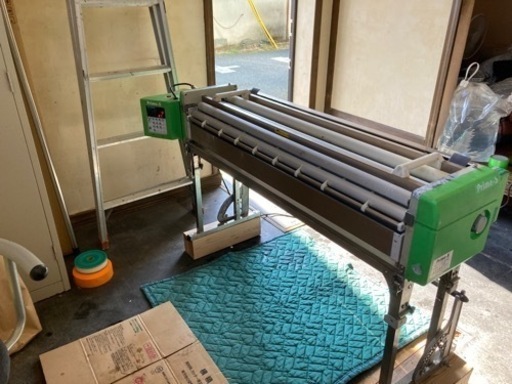クロス糊付け機