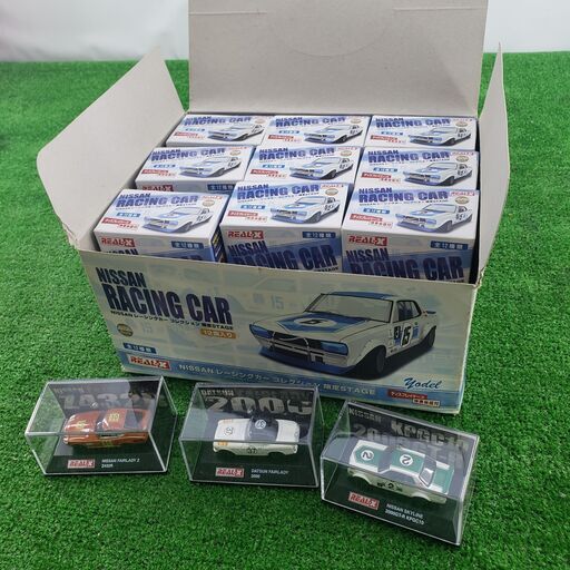 【コレ見て！ おもちゃ】 REAL- X ニッサン レーシングカーコレクション 限定ステージ 全12台 ヨーデル